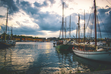 Stockholm skyline at night from the harbor Stockholm canal at down with dramatic sky 