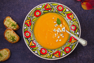 Roasted Pumpkin Soup with Blue Cheese and Garlic Butter Toasts. Butternut Squash Soup. vegetarian dish. overhead, horizontal