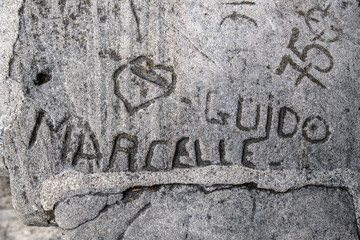 names engraved in a stone in Montmartre,  Paris, France