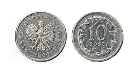 Old used ten Polish groszy coin isolated on white background.