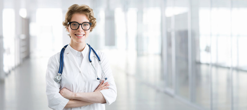 Young female doctor on modern clinic background.