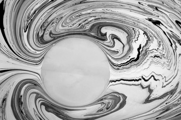 Abstract monochrome marble background with copy space. Stains of paint on the water.