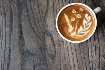 Top view latte art coffee cup.
