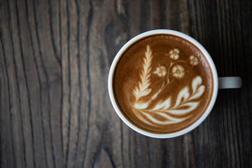 Top view latte art coffee cup.