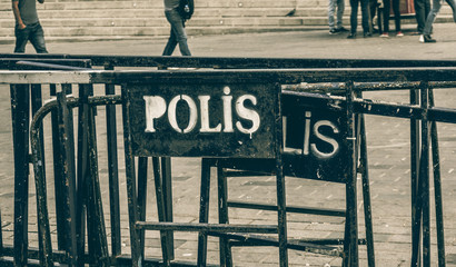 Iron barrier gate with the inscription 