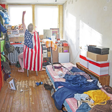 Messy Superman's Room. Piles Of Clothes, Boxes, Books