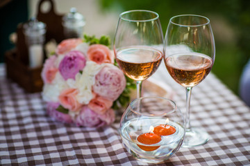 a glass of wine on a table in a cafe