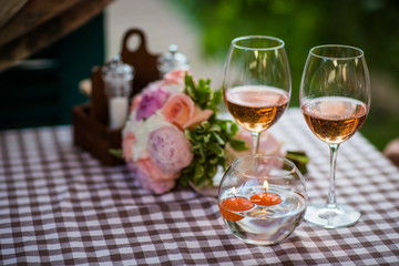 a glass of wine on a table in a cafe