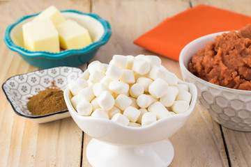 Ingredients for sweet potato casserole with marshmallows and pecans.