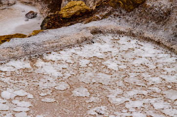 Close up of the saltpeter built in a valley on a cloudy day of Maras in Peru