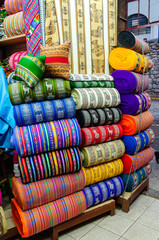 Fototapeta na wymiar Showcase of traditional fabrics in Cusco, Peru