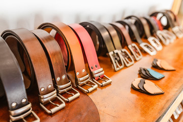 Handmade Leather Belts for sale in a stand of the crafts market