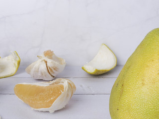 Front view of pomelo, Citrus maxima or Citrus grandis. Flesh and peel scattered . In mid-Autumn Festival, as a gift for friends and relatives. Taiwan food and fruit concept. With copy space.