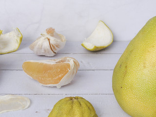 Front view of pomelo, Citrus maxima or Citrus grandis. Flesh and peel scattered . In mid-Autumn Festival, as a gift for friends and relatives. Taiwan food and fruit concept. With copy space.
