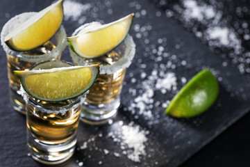 Golden Mexican Tequila on a black background