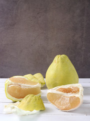 Front view of pomelo, Citrus maxima or Citrus grandis. Flesh and peel scattered . In mid-Autumn...