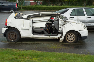 A small white car carved by firemen for training