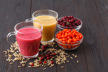 Milkshake with fresh raspberries in a glass
