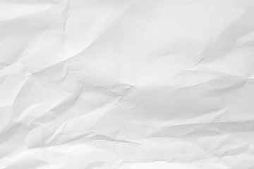 The texture of white paper with kinks. Background of crumpled cardboard.