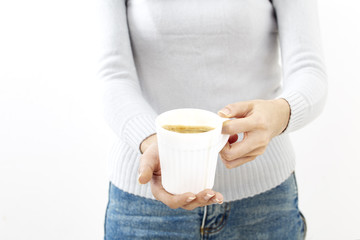 hand holding a coffee cup