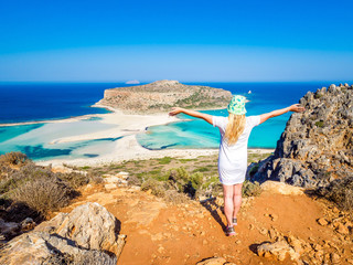 Crete, Greece: Blonde beautyful girl enjoying the beautiful views of Balos lagoon. Lagoon of Balos is one of the most visited tourist destinations on west coast of Crete.