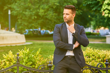 Young man waiting in a park