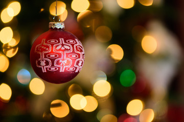 red christmas balls on bokehed background
