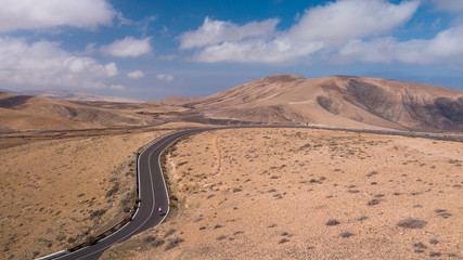 aerial view of road and volcanic mountain