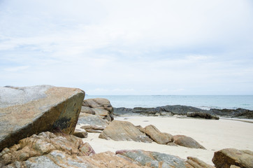 Fototapeta na wymiar great stone on beach with sea background