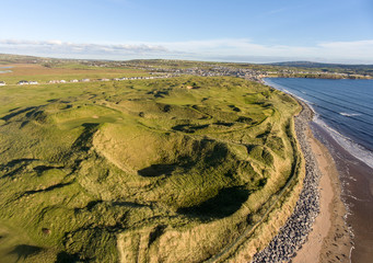 scenic aerial birds eye irish landscape view of lahinch in county clare, ireland. beautiful lahinch beach and golf course in the distance along the wild atlantic way route. - 226539401