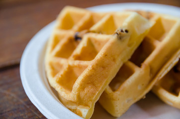 waffles on plate on wooden table
