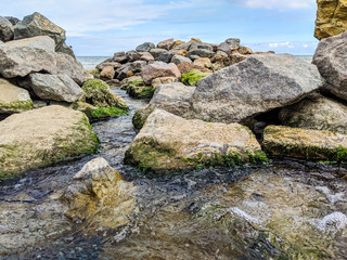 Small creek in the sea during the autumn season
