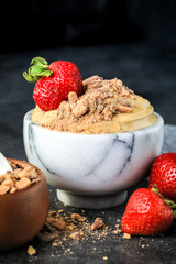 Creamy Chocolate English Toffee Fruit Dip on dark background