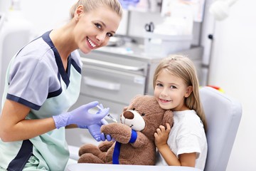 Brave little girl having blood collection for tests