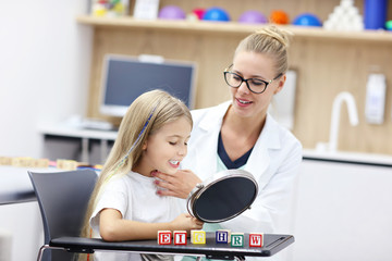 Cute little girl at speech therapist office