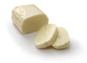 Foto auf Acrylglas halloumi, Cyprus squeaky cheese isolated on white background © uckyo