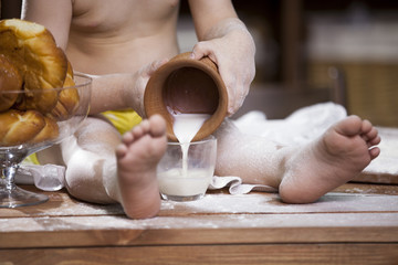 cook a little boy drinking milk