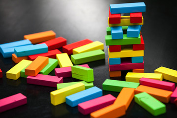Gang game on a black table, colored cubes