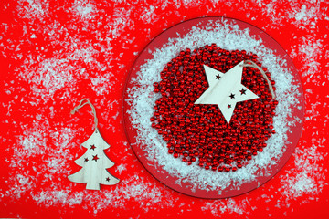 Red Christmas ornaments and wooden star snowflake and tree