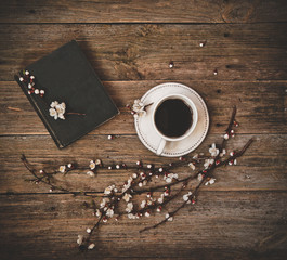 cup coffee white saucer book wooden background