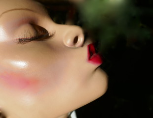 Head of a female mannequin with red, sexy kiss mouth and high cheekbones
