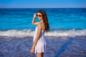 Fototapeta na wymiar Girl in beach sea shore with summer dress