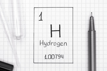 Handwriting chemical element Hydrogen H with black pen, test tube and pipette.