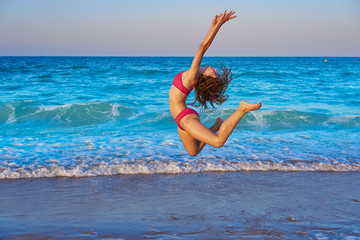 acrobatic gymnastics bikini girl in a beach