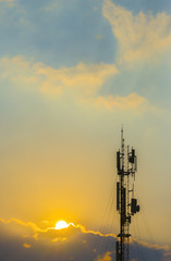 Telecommunication towers with colorful sky backgrounds at sunset