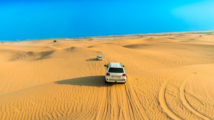 car in the desert © INIEO