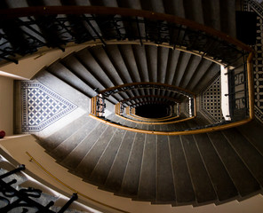 Obraz premium Geometry lines in retro ladder stairs in a house with a dark light