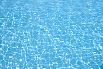 Wonderful crystal light blue clear water of a swimming pool