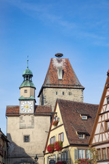 Fototapeta premium town gate in Rothenburg ob der Tauber with stork nest on top
