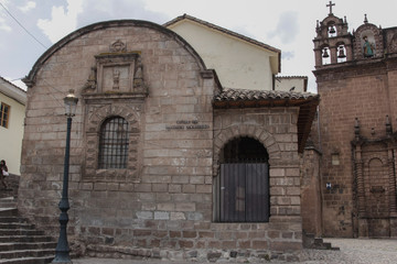 Fototapeta na wymiar Old catholic church facade in Cuzco Peru